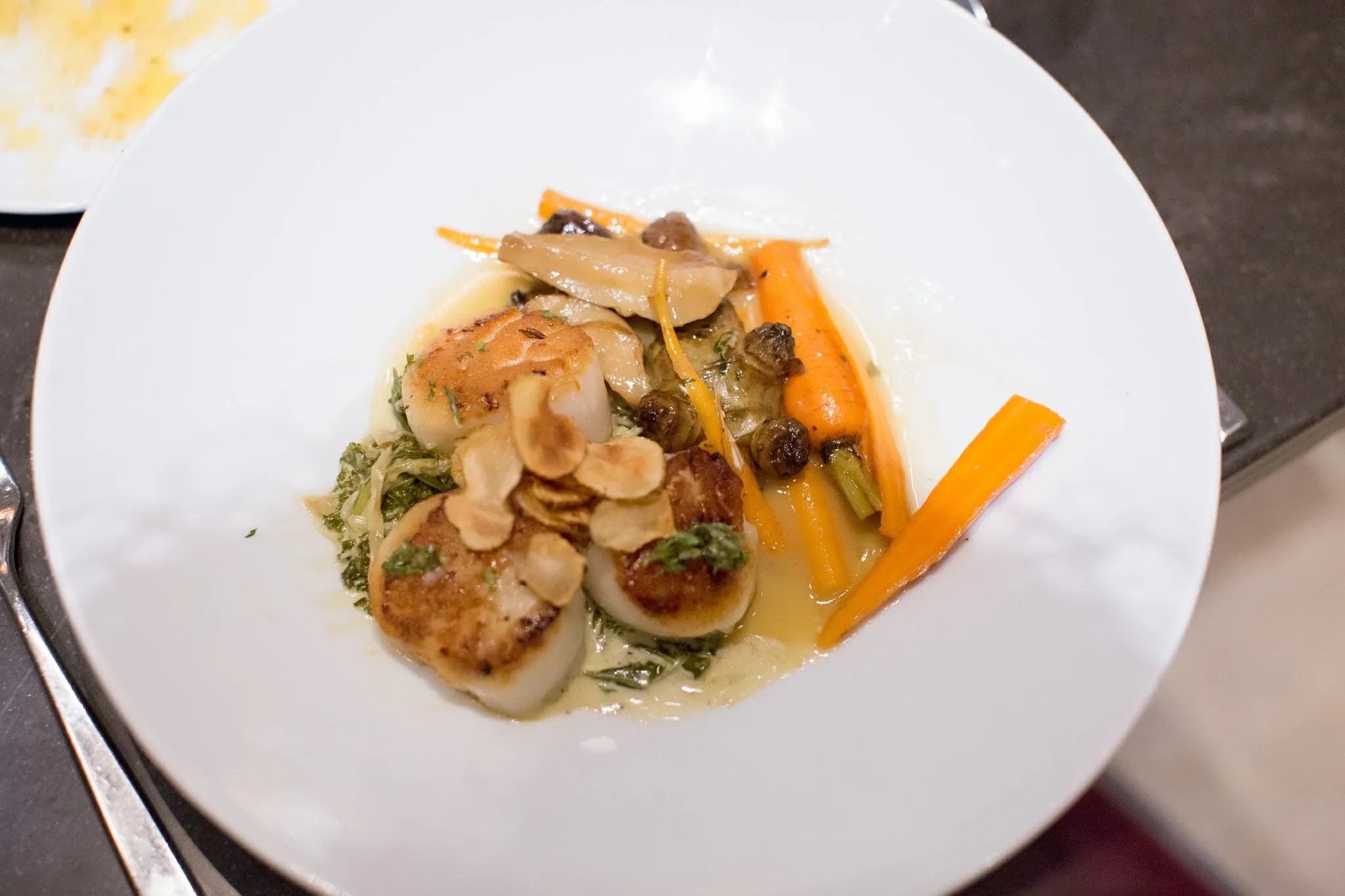 Counting House signature dishes Charcuterie and Cheese Boards, Seared Scallops, Berkshire Pork Chop, Counting House Burger